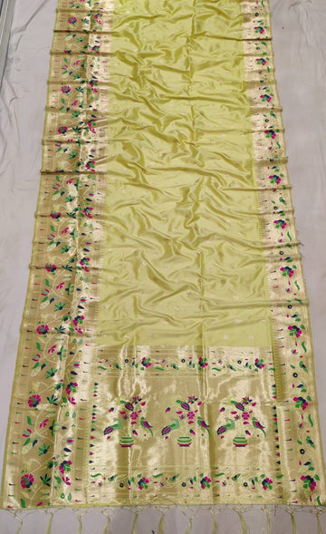 Pastel yellow color with rich paithani border saree